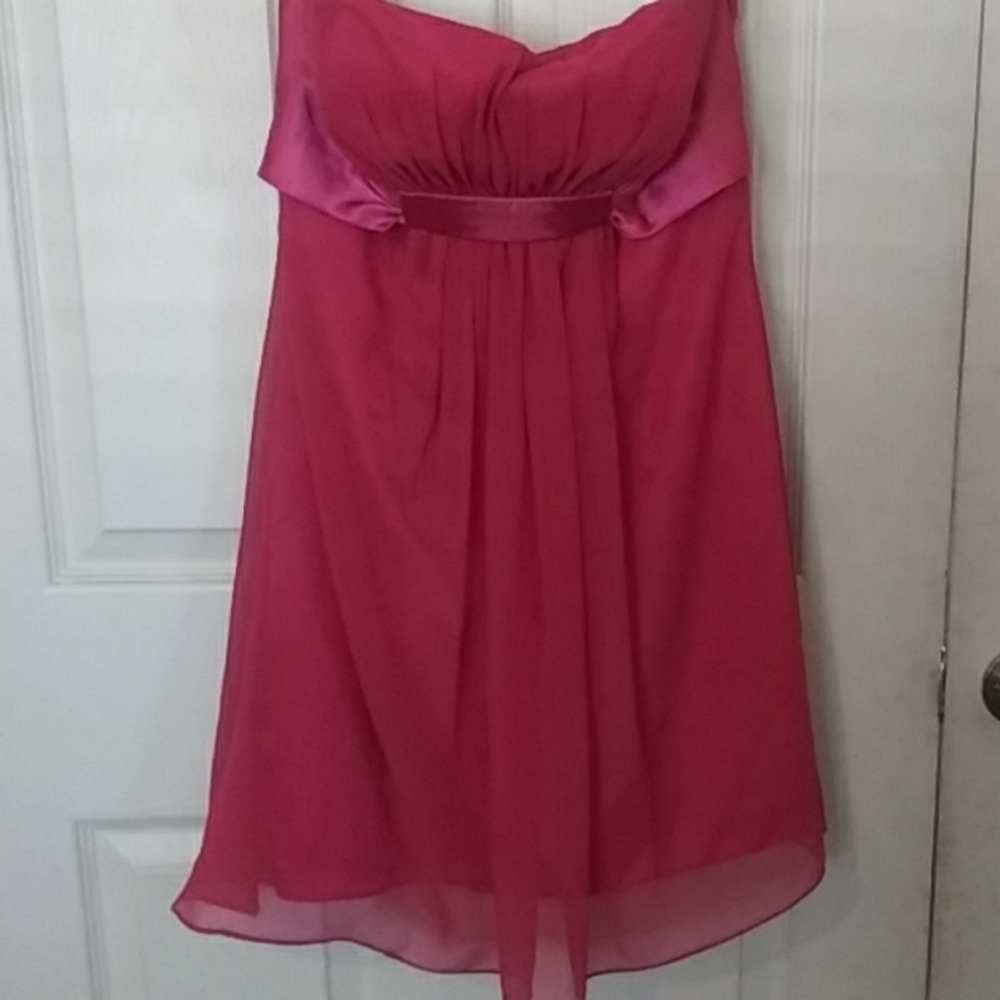 Above the knee, strapless fuschia dress